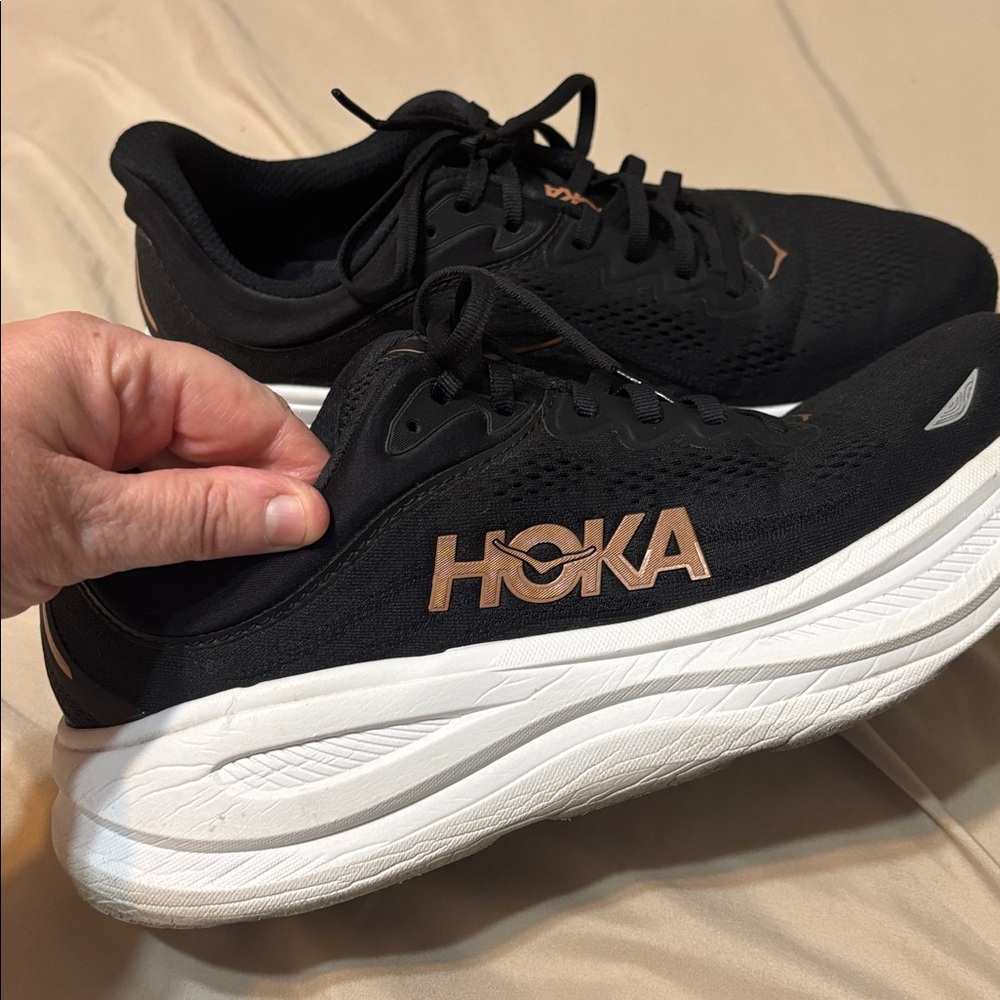 Hoka Bondi black and white shoes with rose gold
